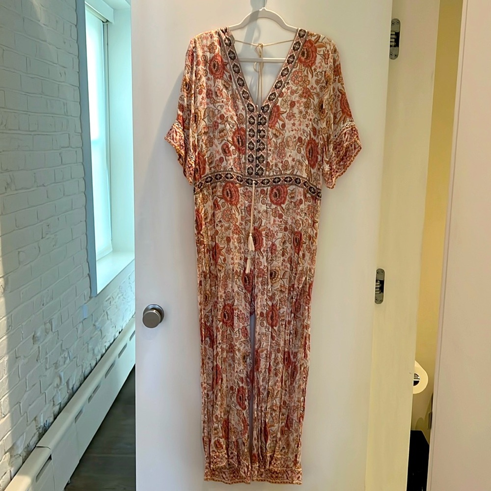 SPELL jumpsuit with split leg size S. Lining is short length.